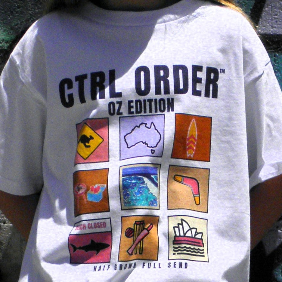 Youth model wearing Aussie Icons t-shirt in white with pastel pink Australian icon graphic - kids streetwear by CTRL ORDER Australia