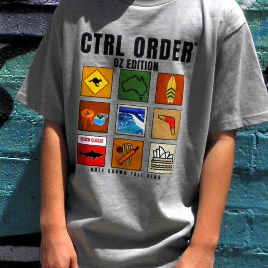 Child wearing CTRL ORDER OZ Edition youth t-shirt in stone colour with Australian icon grid graphic